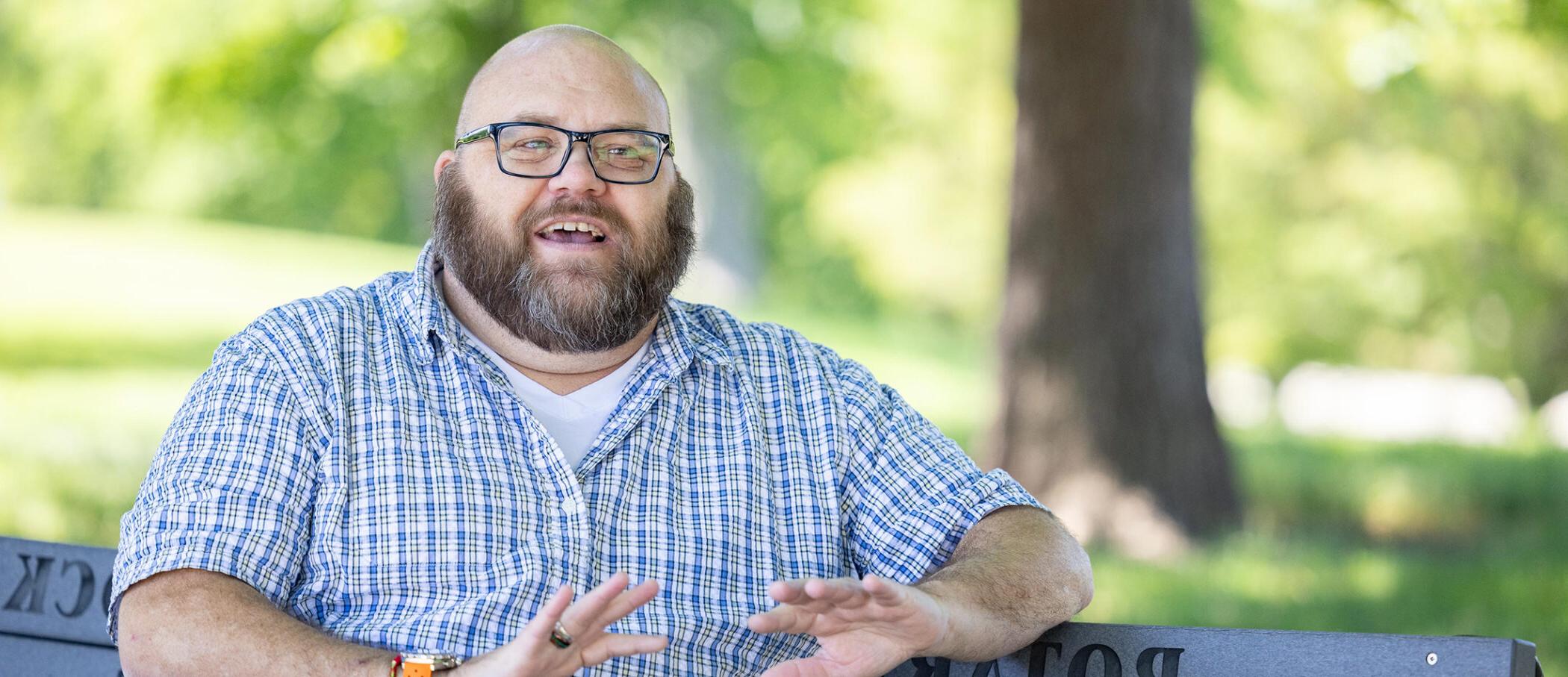 Jonathan Sprinborn sitting on a park bench.